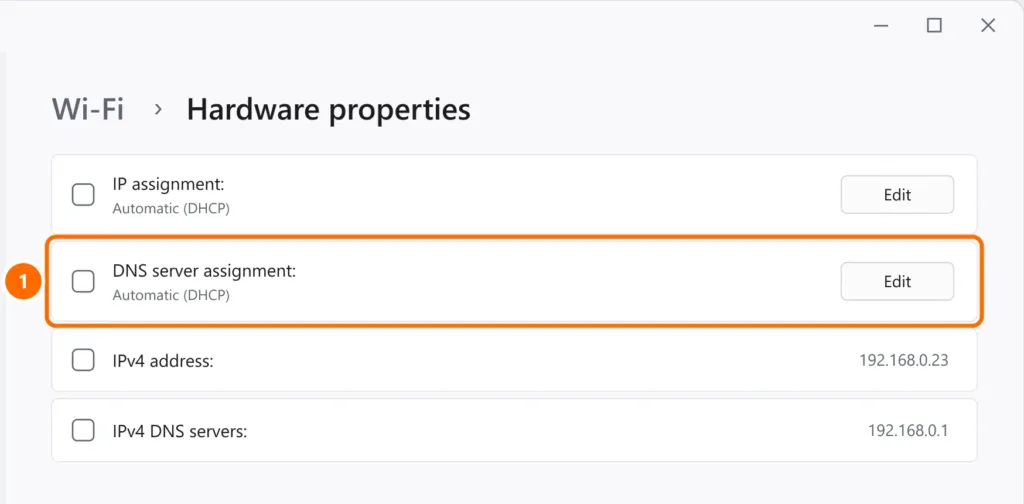 Wi-Fi hardware properties in Windows 11 with the Edit button for DNS server assignment highlighted