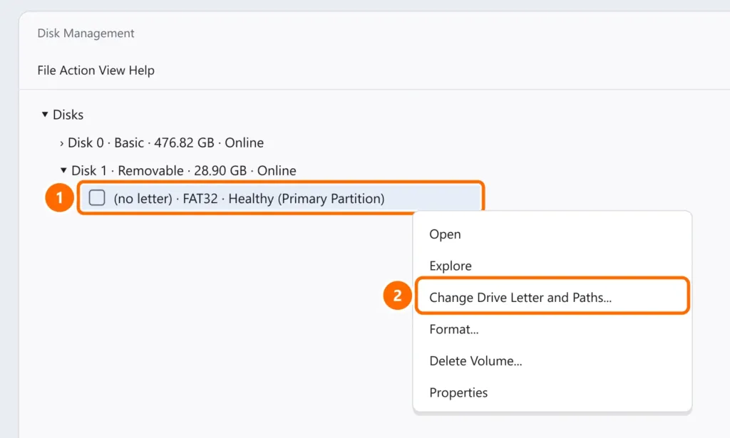 Disk Management with the USB drive without a drive letter selected and Change Drive Letter and Paths highlighted