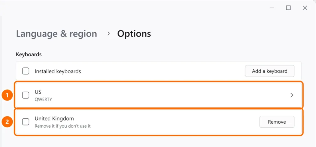Language options with the installed keyboards US and United Kingdom, and the Remove button highlighted