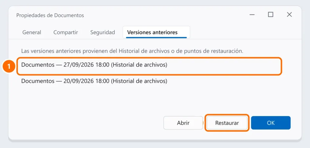 Pestaña Versiones anteriores de la carpeta Documentos con una versión del Historial de archivos seleccionada y el botón Restaurar destacado